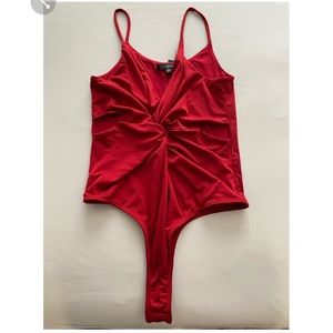 Red Lulus body suit with twist in the front, small keyhole on each side